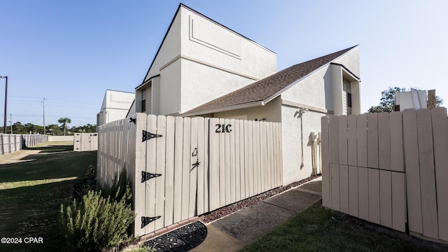 view of home's exterior with a yard