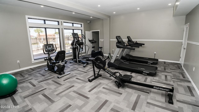 exercise room with carpet flooring