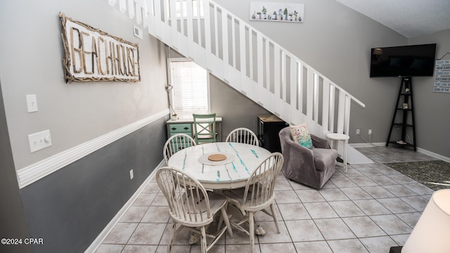 dining area featuring light tile patterned floors