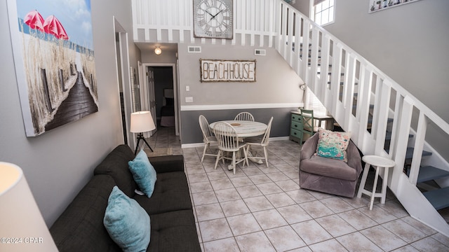 living room with a high ceiling