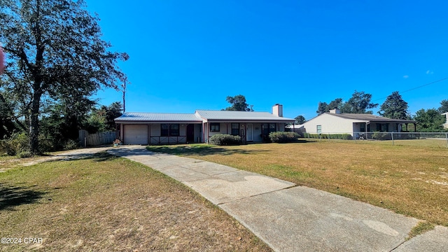 single story home with a front lawn and a garage