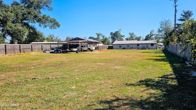 view of yard with a carport