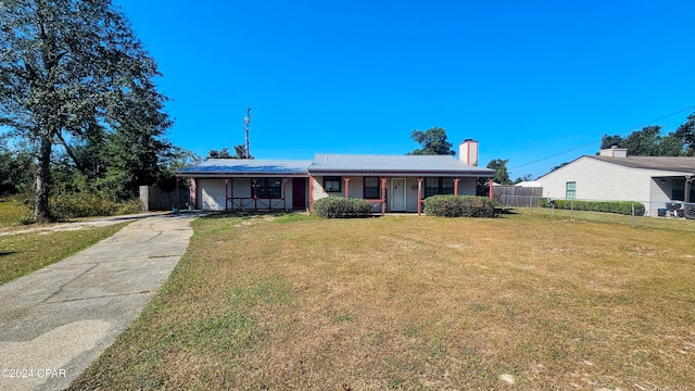 ranch-style house with a front lawn