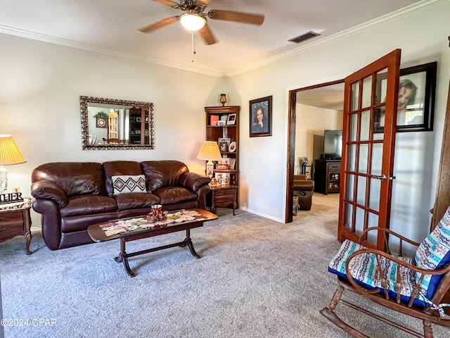 carpeted living room featuring ceiling fan, ornamental molding, and french doors