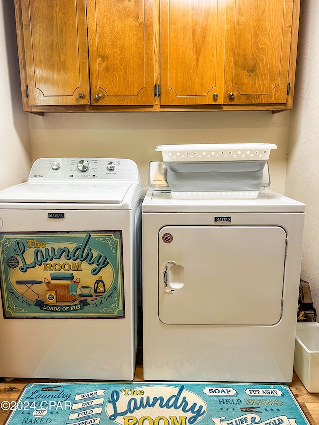 laundry room featuring cabinets and independent washer and dryer