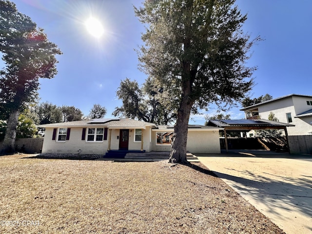 view of front of property with a carport