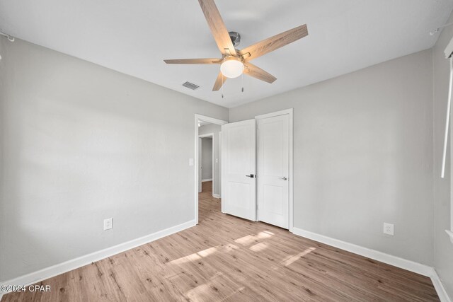 unfurnished bedroom with a closet, ceiling fan, and light hardwood / wood-style flooring