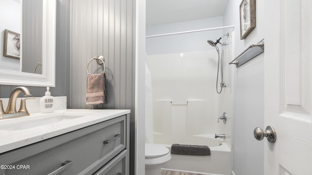 full bathroom with vanity, tub / shower combination, and toilet