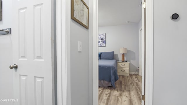 corridor featuring light hardwood / wood-style flooring