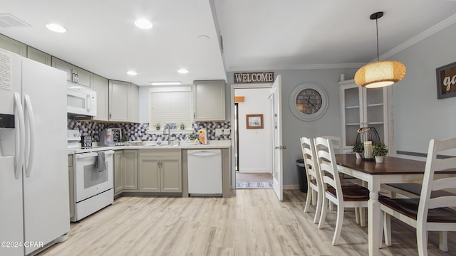 kitchen with white appliances, light hardwood / wood-style flooring, gray cabinetry, tasteful backsplash, and decorative light fixtures