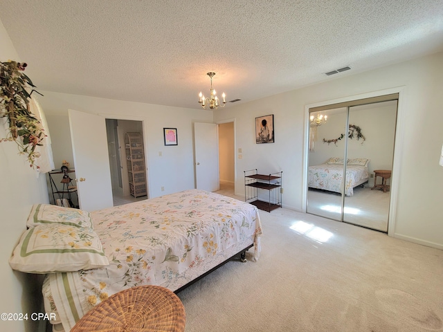 17680 Margaret St, Blountstown, FL 32424 - carpeted bedroom featuring a chandelier, visible vents, a closet, and a textured ceiling