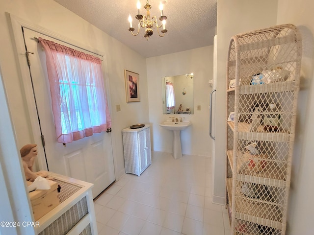 17680 Margaret St, Blountstown, FL 32424 - interior space featuring tile patterned floors, a notable chandelier, and a textured ceiling