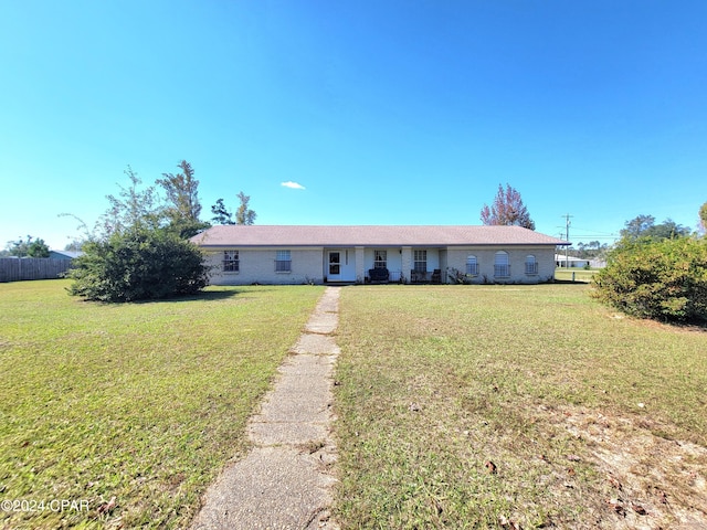 single story home featuring a front yard