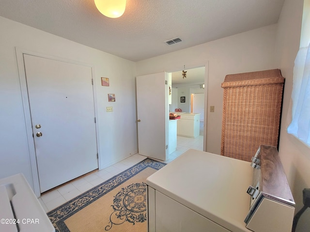 17680 Margaret St, Blountstown, FL 32424 - interior space featuring visible vents, light tile patterned floors, and a textured ceiling