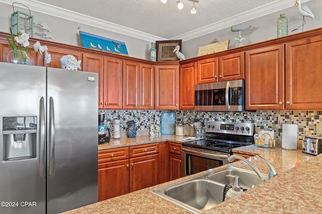 kitchen featuring decorative backsplash, stainless steel appliances, ornamental molding, sink, and a textured ceiling