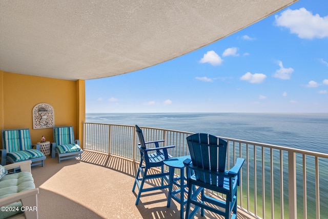 balcony featuring a water view