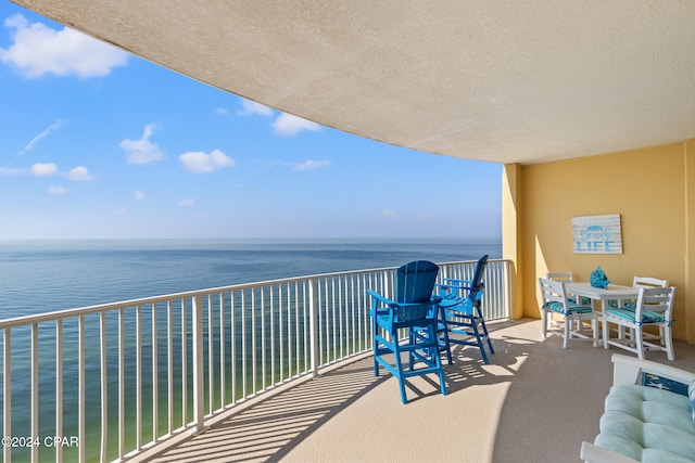 balcony featuring a water view