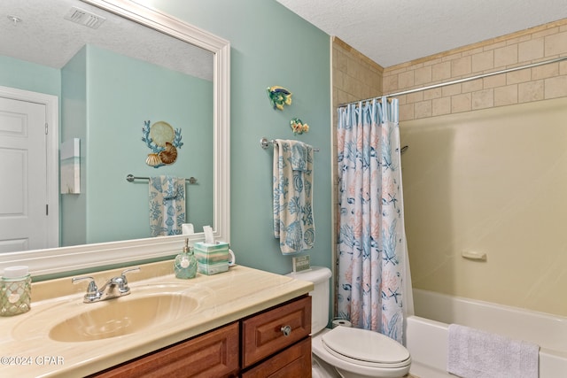 full bathroom featuring shower / bath combination with curtain, toilet, a textured ceiling, and vanity