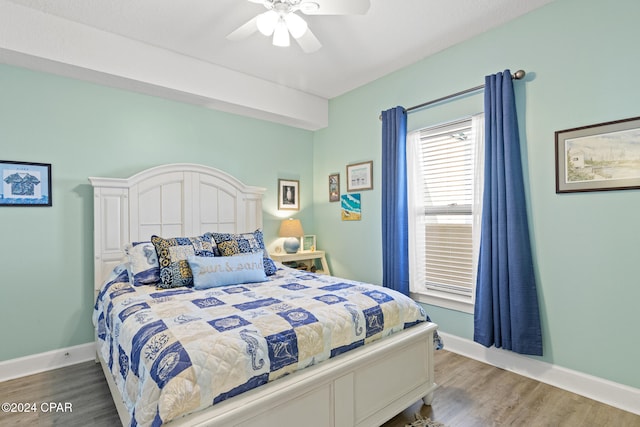 bedroom featuring wood-type flooring and ceiling fan