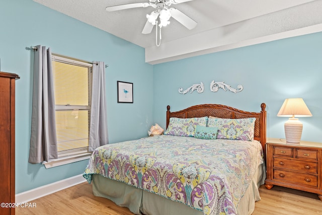 bedroom featuring light hardwood / wood-style floors and ceiling fan