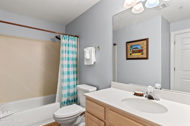 full bathroom featuring vanity, toilet, a textured ceiling, and shower / bath combo