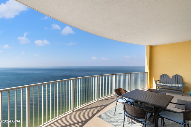 balcony featuring a water view