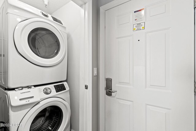 17545 Front Beach Rd Unit 2308, Panama City Beach, FL 32413 - laundry room featuring stacked washer / drying machine
