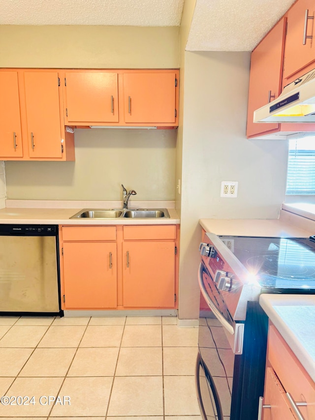 kitchen with sink, a textured ceiling, light tile patterned floors, stainless steel dishwasher, and range with electric cooktop