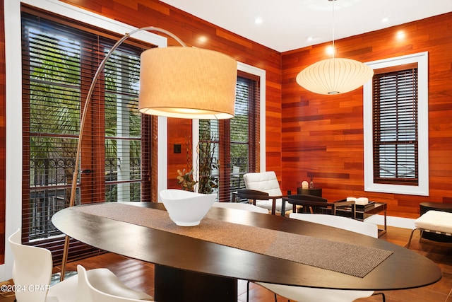 living room with track lighting and wooden walls