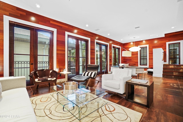 kitchen featuring sink, hanging light fixtures, tasteful backsplash, and oven