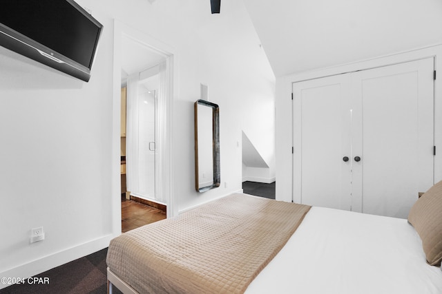 bedroom with sink, ceiling fan, light tile patterned floors, and ensuite bath