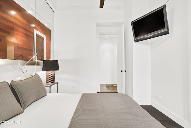 bathroom with toilet, vanity, wood-type flooring, and ceiling fan