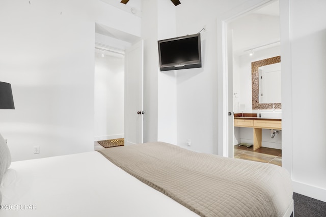 bedroom with dark carpet, vaulted ceiling, and ceiling fan