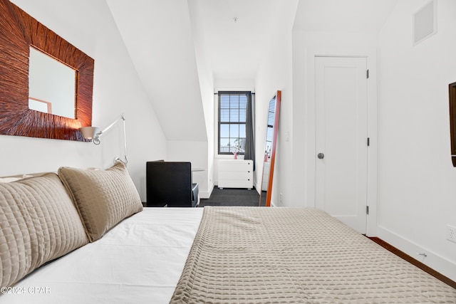 bedroom with connected bathroom, ceiling fan, and carpet floors