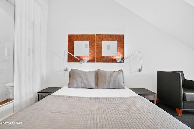 bedroom with dark hardwood / wood-style flooring