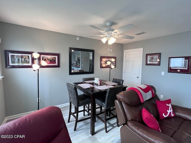 dining space featuring light hardwood / wood-style floors and ceiling fan