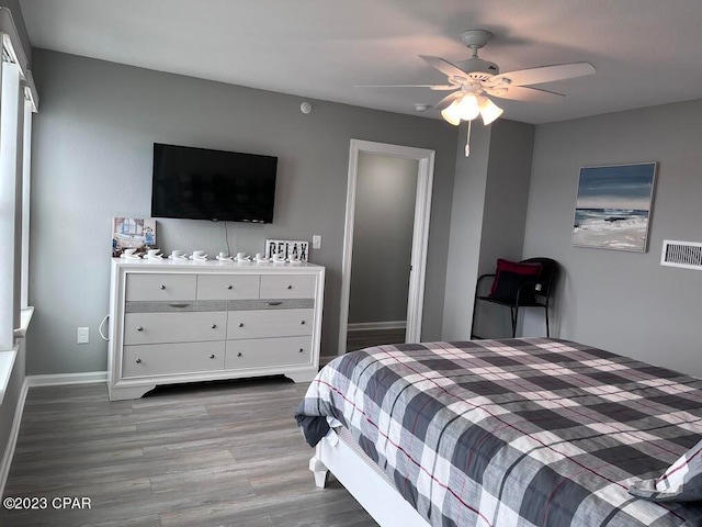 bedroom with hardwood / wood-style flooring and ceiling fan