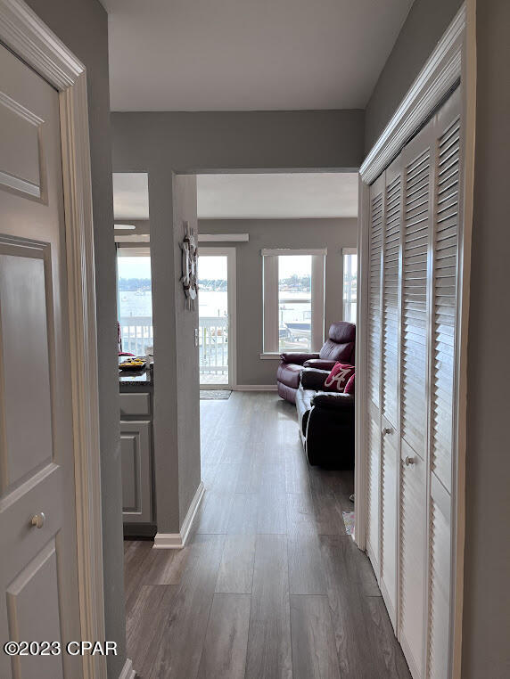 corridor featuring dark hardwood / wood-style floors