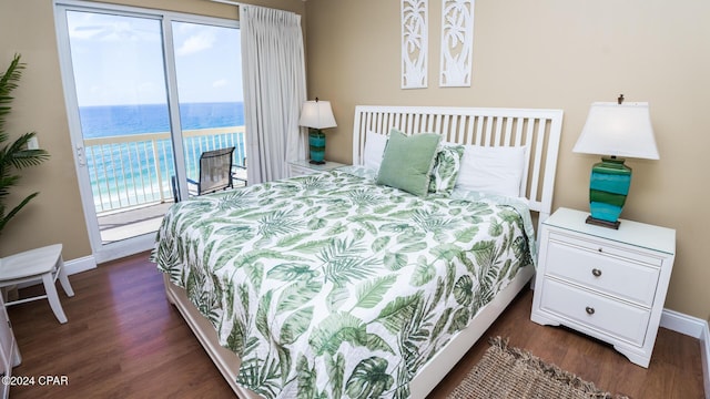 15817 Front Beach Rd Unit 1-906, Panama City Beach, FL 32413 - bedroom with access to exterior, dark wood-style floors, baseboards, and a water view