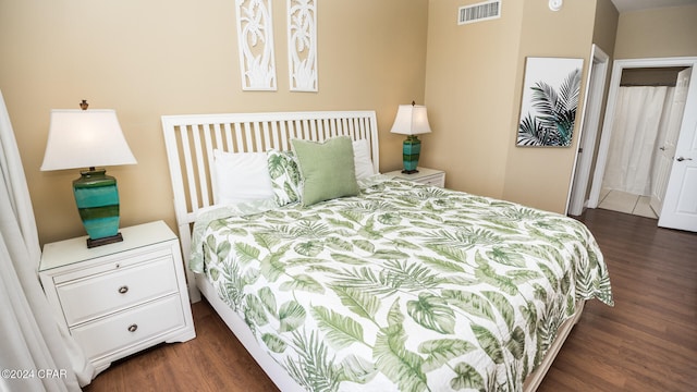 bedroom featuring dark hardwood / wood-style flooring