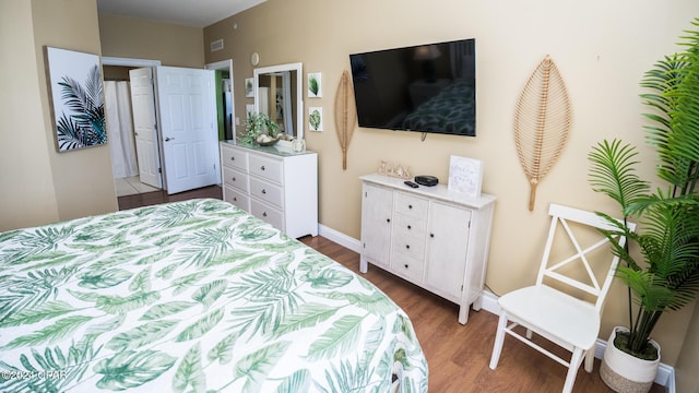 15817 Front Beach Rd Unit 1-906, Panama City Beach, FL 32413 - bedroom with dark wood-type flooring and baseboards