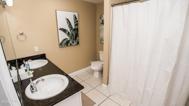 bathroom featuring a shower with shower curtain, tile patterned flooring, vanity, and toilet