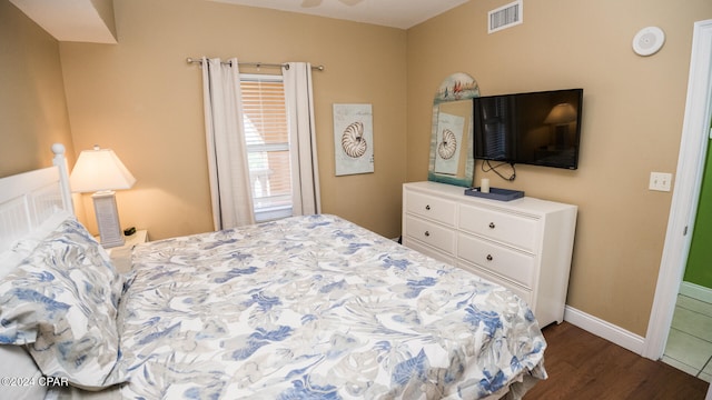 bedroom featuring dark hardwood / wood-style floors