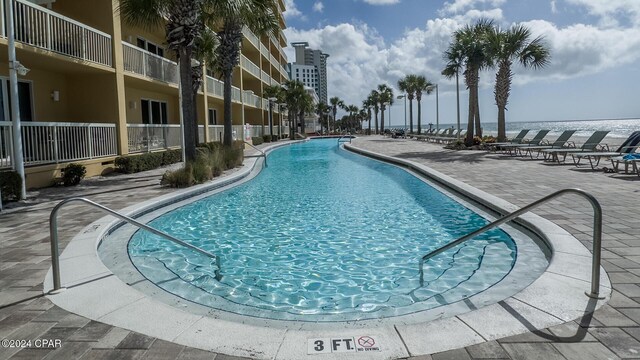15817 Front Beach Rd Unit 1-906, Panama City Beach, FL 32413 - community pool featuring a patio and a water view