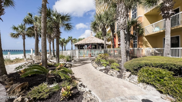 view of home's community with a water view and a gazebo