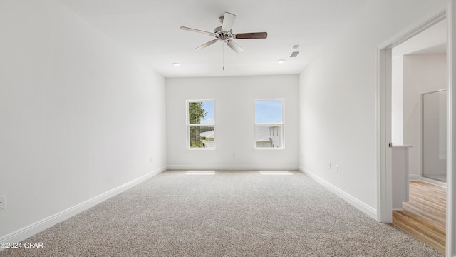 carpeted empty room with ceiling fan