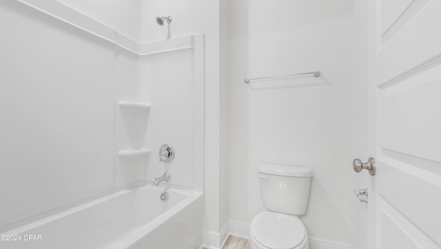 bathroom with shower / tub combination and toilet