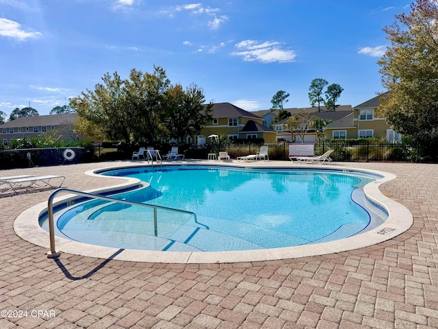 view of swimming pool with a patio area