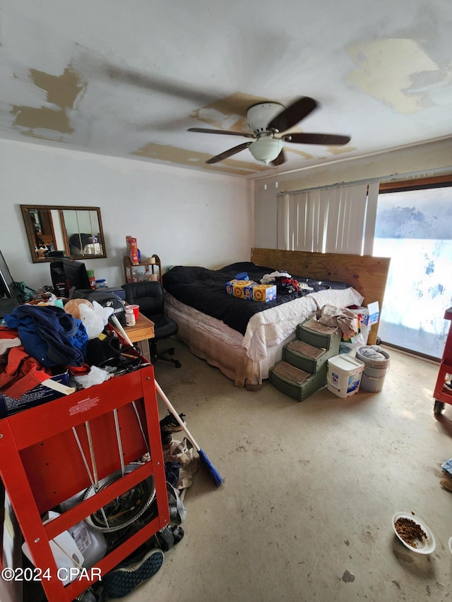 bedroom featuring concrete floors and ceiling fan