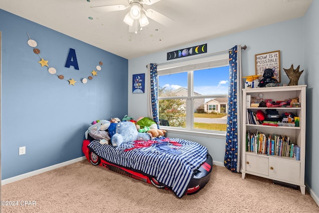 carpeted bedroom with ceiling fan